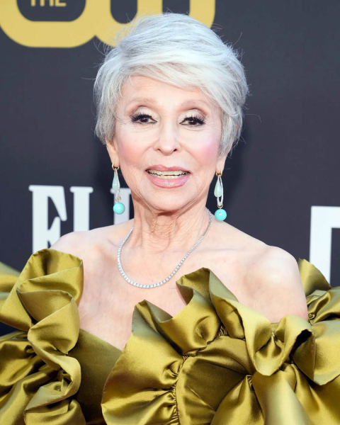 Rita Moreno in a chartreuse gown