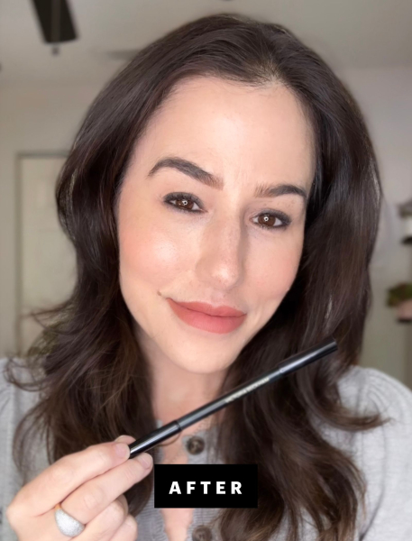 Marci Robin holding up kajal eyeliner
