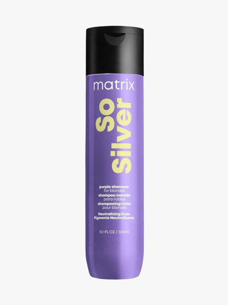 Matrix So Silver Purple Shampoo purple bottle of shampoo with black cap on light gray background