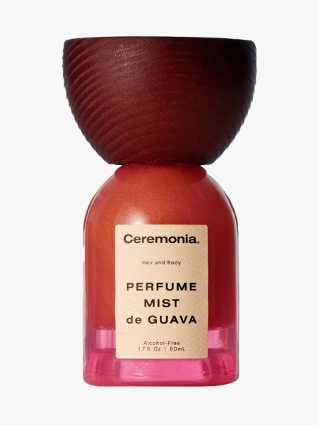 Ceremonia Perfume Mist de Guava for Hair & Body pink bottle with a large wood cap on light gray background