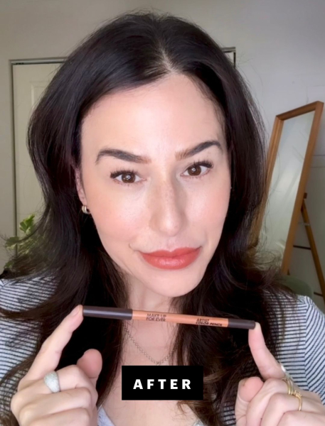 Marci Robin holding up an eyeliner pencil