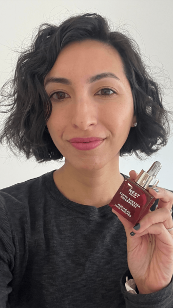 Allure from contributing editor Deanna Pai holding the Nest New York Santa Barbara Strawberry Perfume Oil